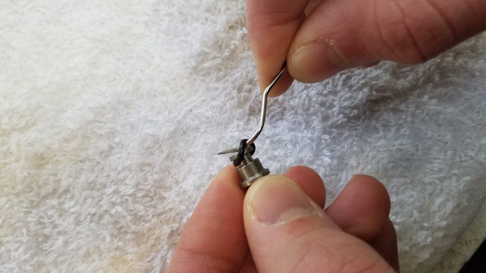 Use a metal probe to remove the O-Ring