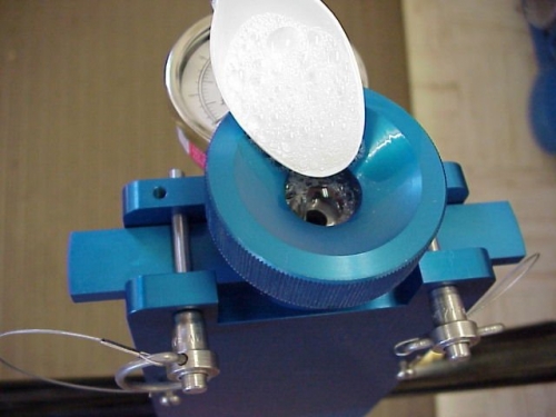 Check the inside of the lid where the sample is sealed into the lid.