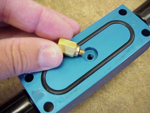 The valve needs to be removed, cleaned in soapy water and use some compressed air to blow through the check valve