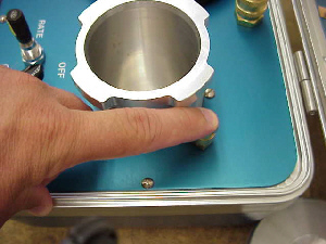 use your finger to depress the piston so that it is inside the safety valve