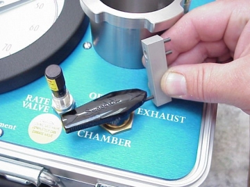 Use the allen key end of the valve adjustment tool to loosen the set screw in black handle of the control valve