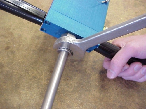 loosen the outer nut of the fitting that holds the Compression Tube into the chamber