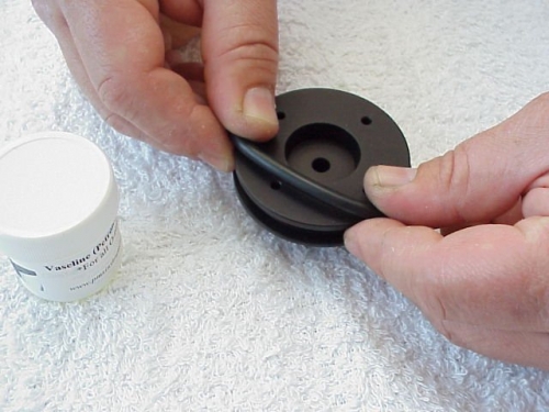 lubricate the large (size 330) O-Ring and place over the Compression Gland Base