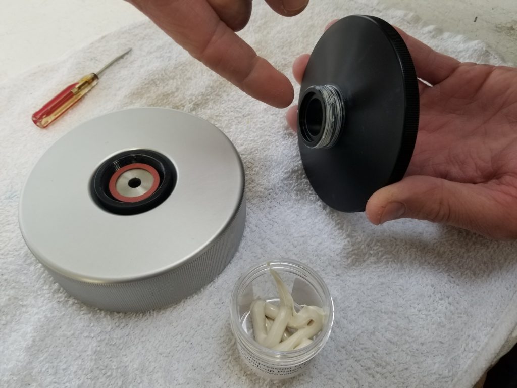 Lubricate the threads of the Compression Gland Screw lightly with white Lithium Grease