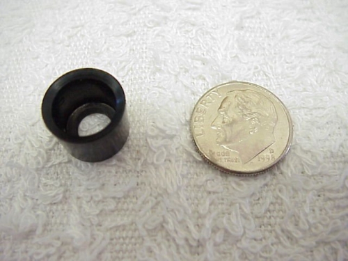 New piston cup compared to a coin