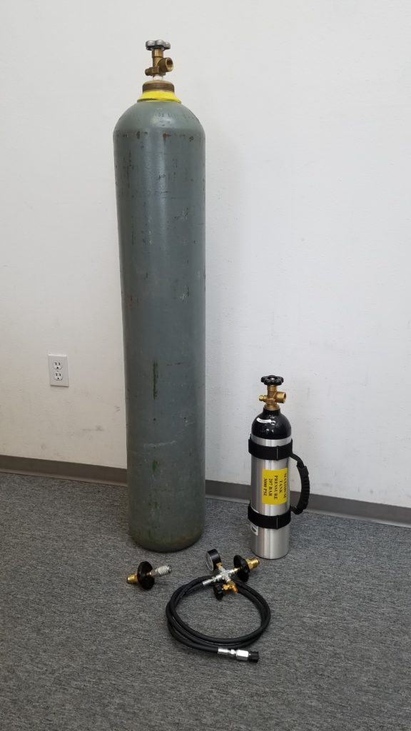 a supply tank, portable tank, supply tank adapter, and a 6 foot filling hose