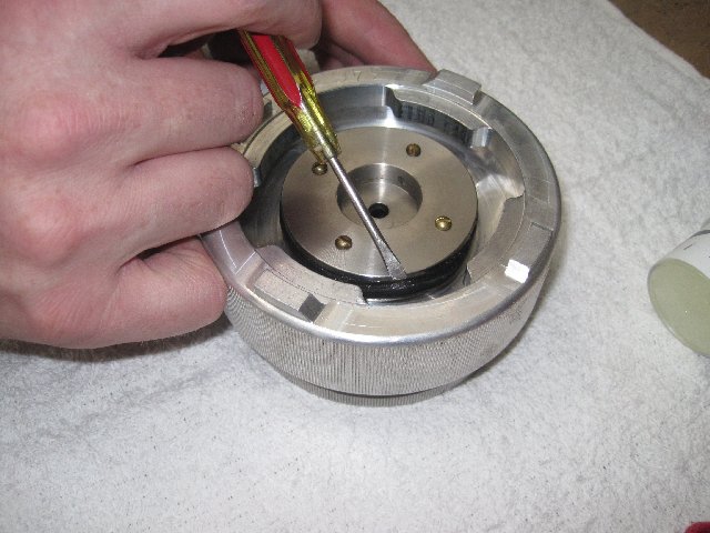 Use a flat screw drive or flat stick to remove the O-Ring