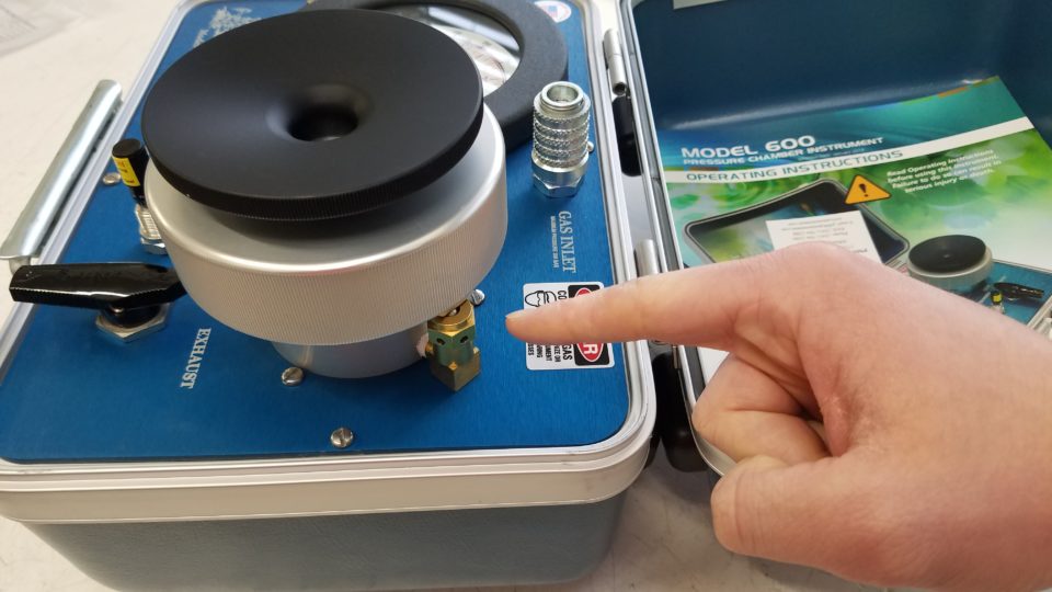 The Safety Valve is located under the Lid on the far side of the chamber