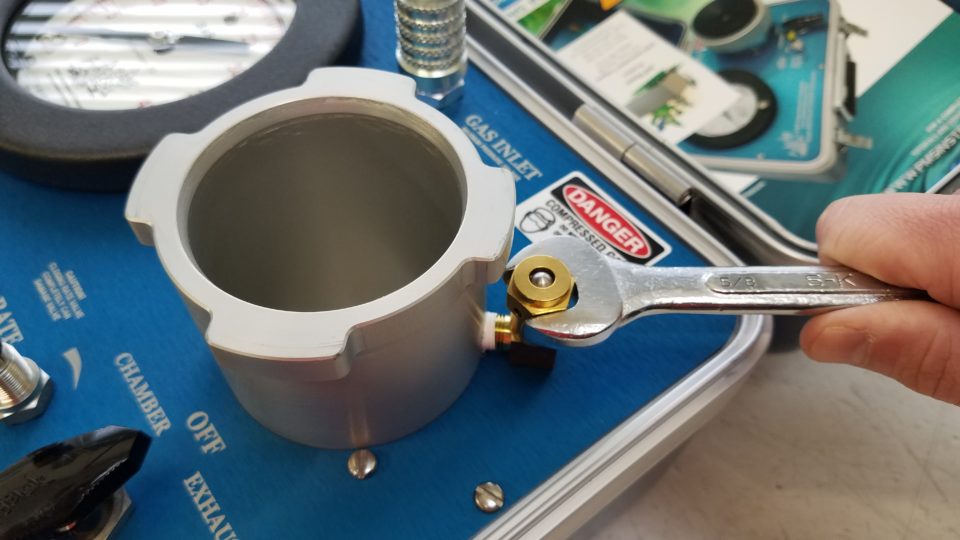 Use the 5/8 Inch wrench to gently snug the Cap into place