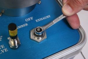 Using the box end of the combination wrench, slowly tighten the packing gland nut