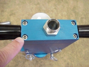 Tighten the 4 stainless steel cap screws at the bottom of the chamber.