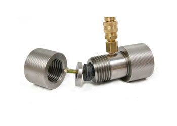 The rubber gaskets slide down the sample and seat inside the chamber.